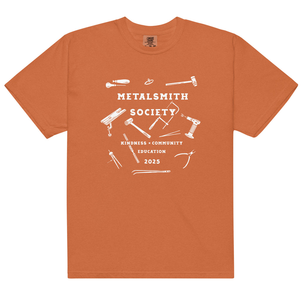 Yam: "2025 Unisex Metalsmith Society Shirt in yam orange, featuring the limited edition design by Kinsey H Designs.