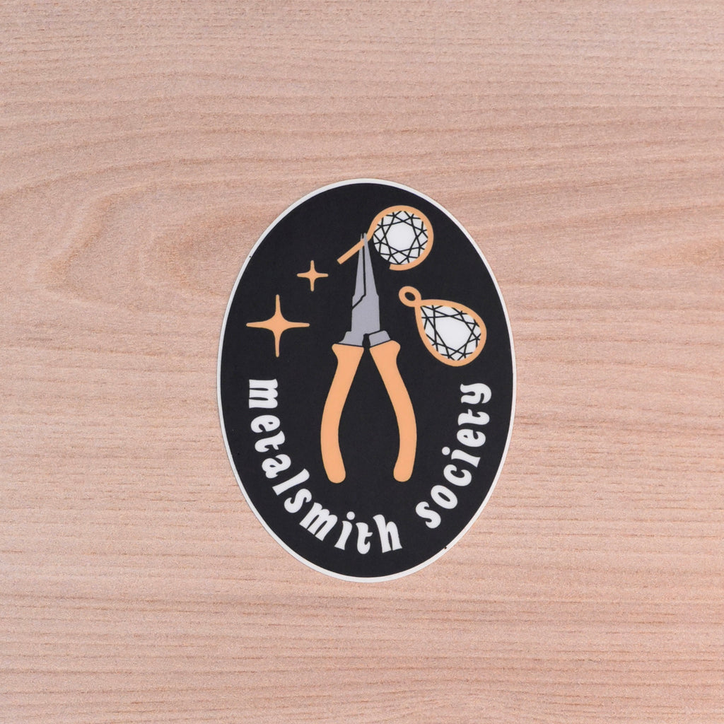 Metalsmith Society sticker featuring jewelry pliers and stars on black oval background