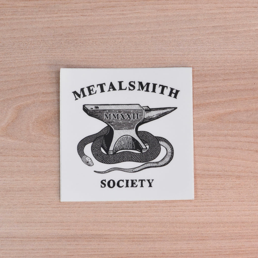 Metalsmith Society sticker with anvil and snake design, black and white