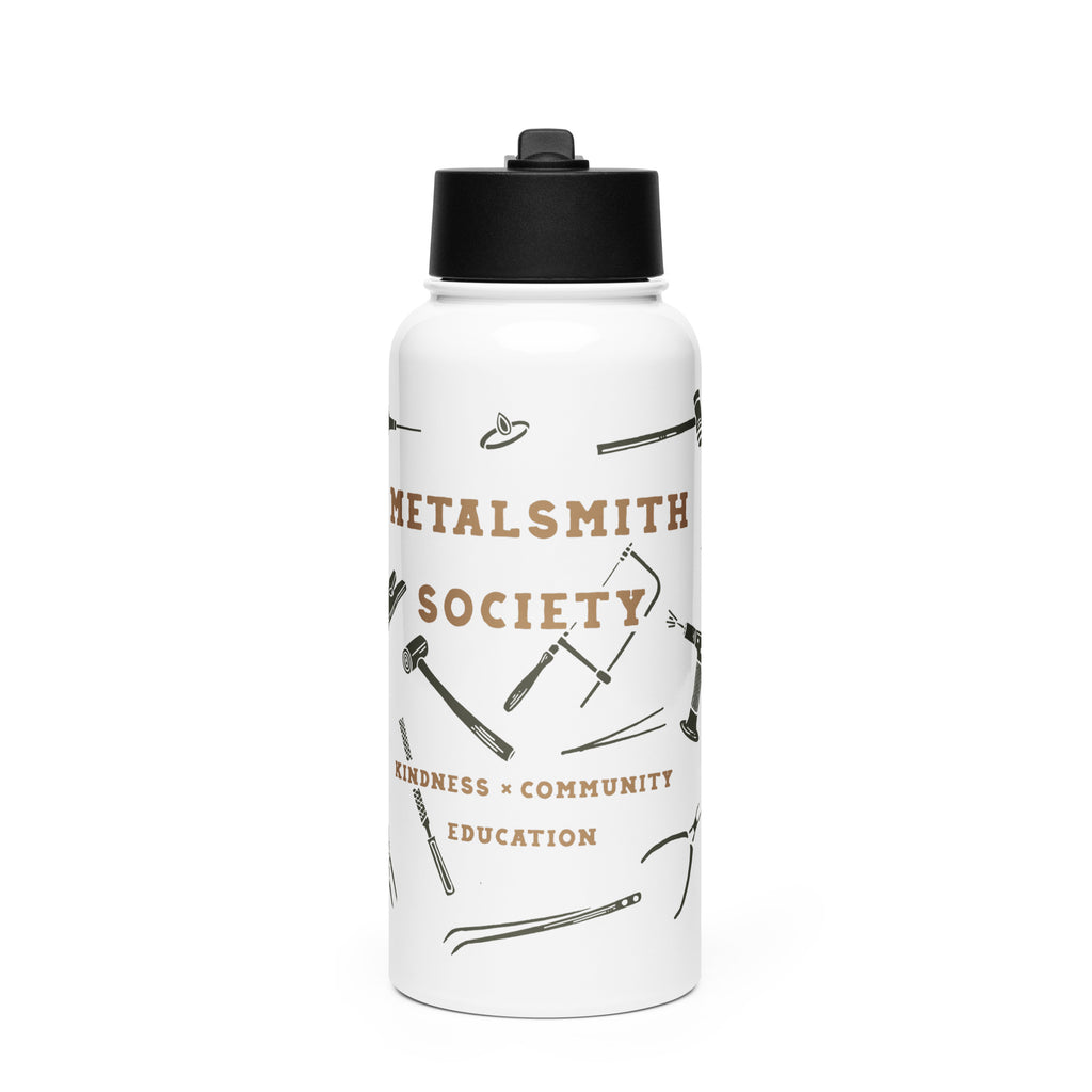 Front view of the water bottle: "Stainless steel water bottle featuring illustrations of jewelry-making tools, including a jeweler's saw, hammer, and pliers, on a sleek black background.