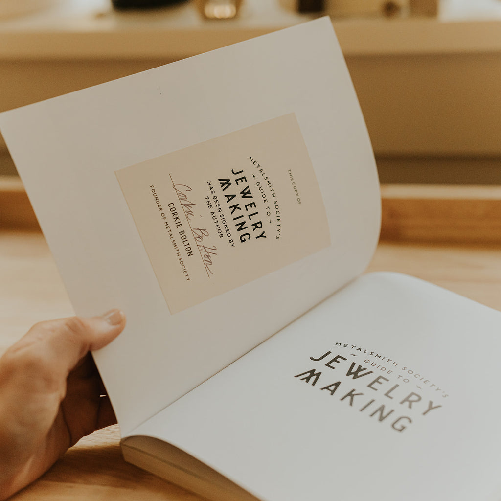 Inside cover of the book Metalsmith Society's Guide To Jewelry Making by Corkie Bolton, showing a signed book plate.